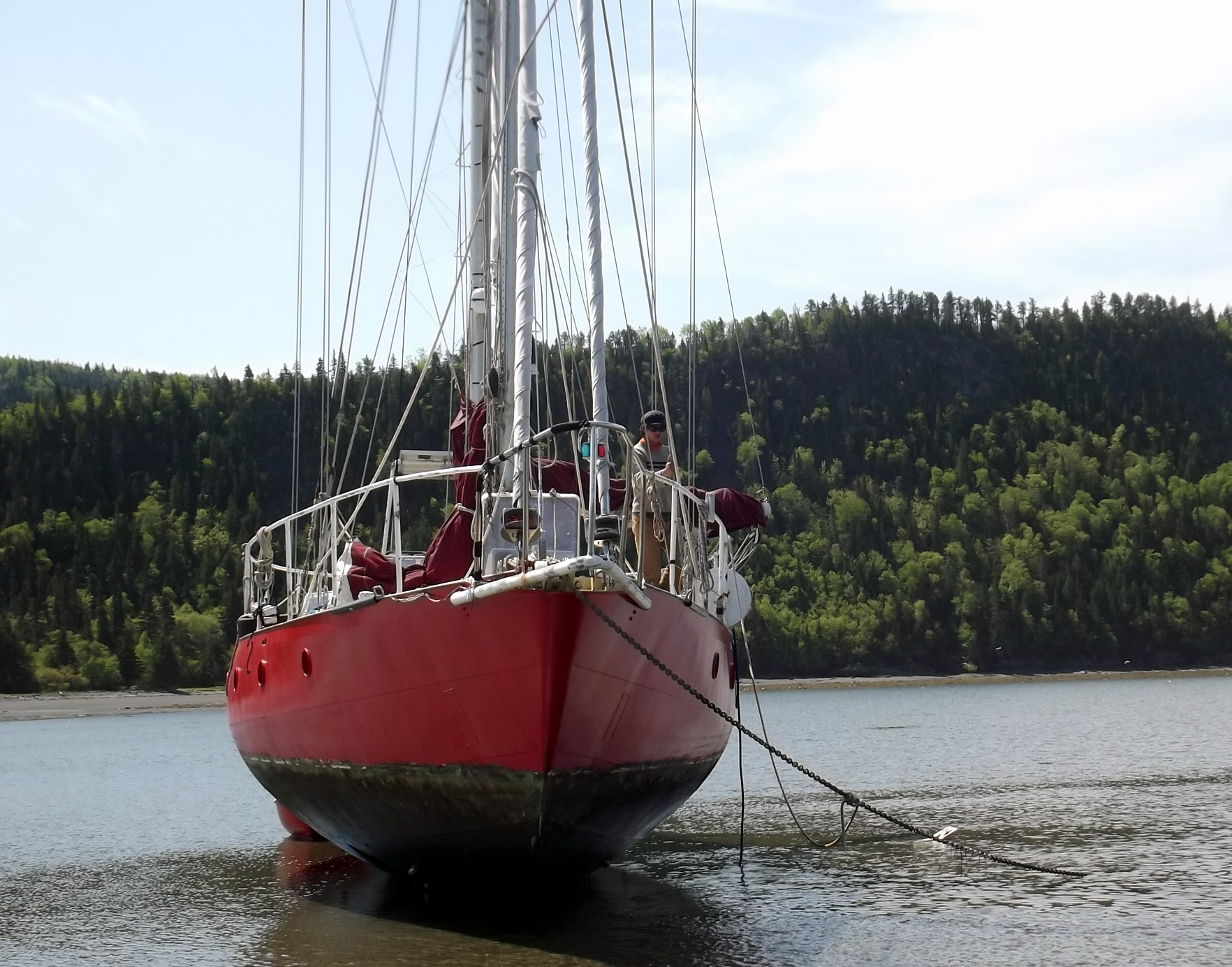 View from bow of Issuma dried out on beach, showing hull