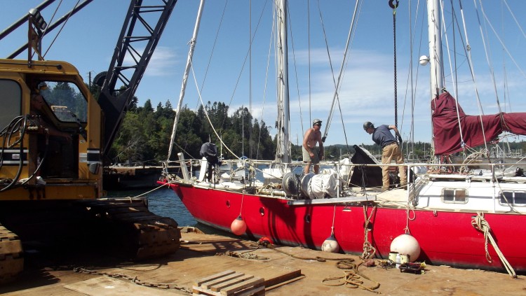 Lowering centerboard into trunk, pic from beside boat